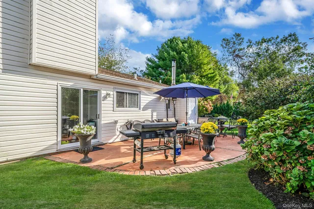 a house view with a seating space and garden