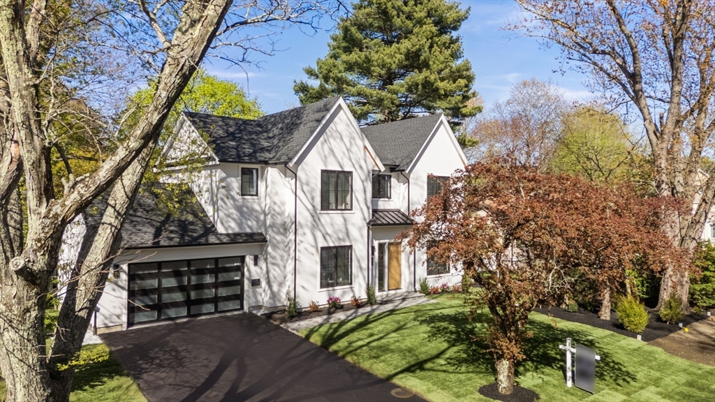 470 Quinobequin Road Newton, MA 02468 - Photo 35 of 37 a view of a house with a yard