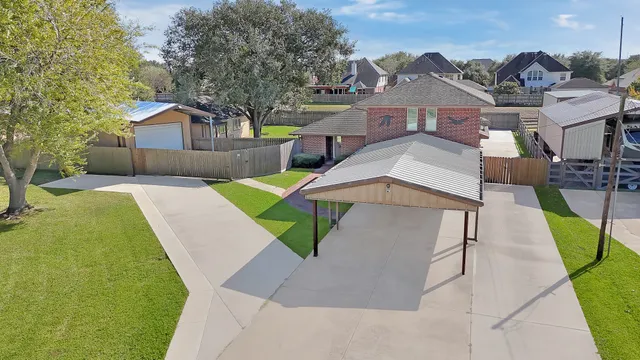 a living room with a fireplace and wooden floor