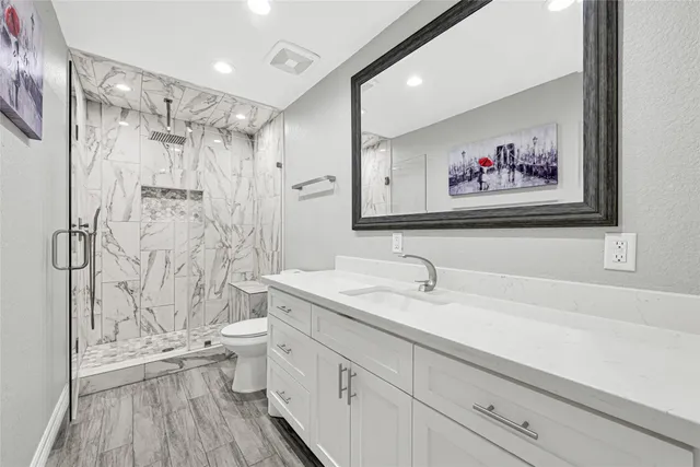 a dining room with furniture and a floor to ceiling window