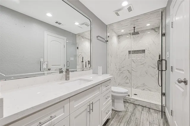 a view of a kitchen with a sink and a refrigerator