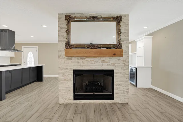 a kitchen with a sink stainless steel appliances and white cabinets