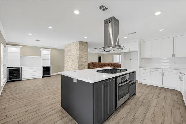 a bathroom with a granite countertop sink a toilet and a shower