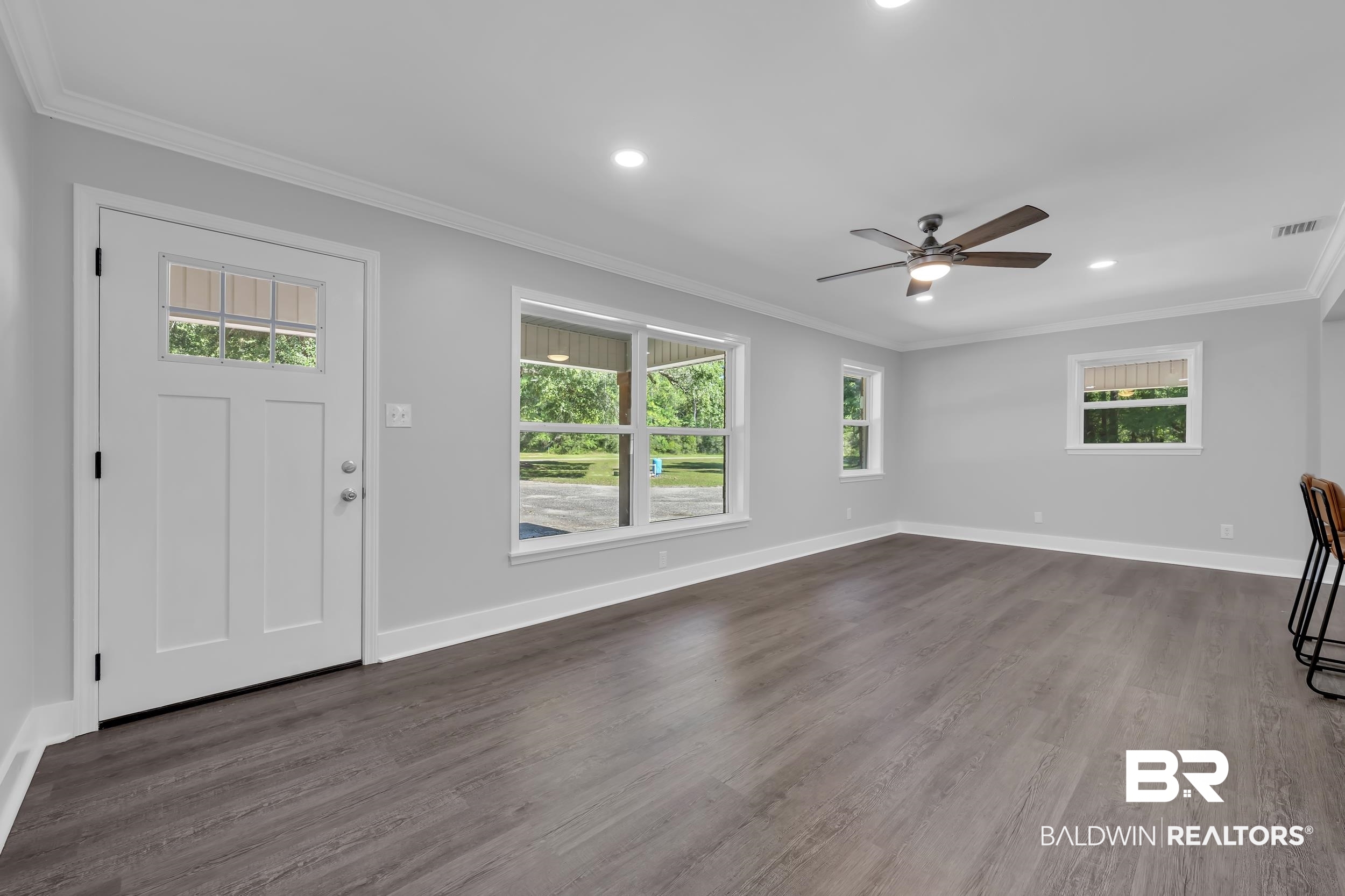 2712 Shelton Beach Rd Extension Mobile, AL 36613 - Photo 5 of 24 Spacious living area featuring wood-finish flooring, recessed lighting, and a ceiling fan