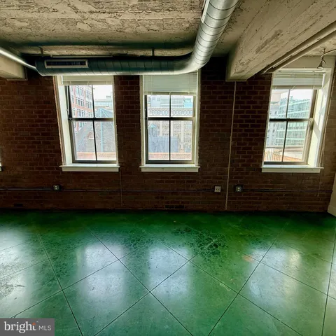 a bed room with a bed and a window