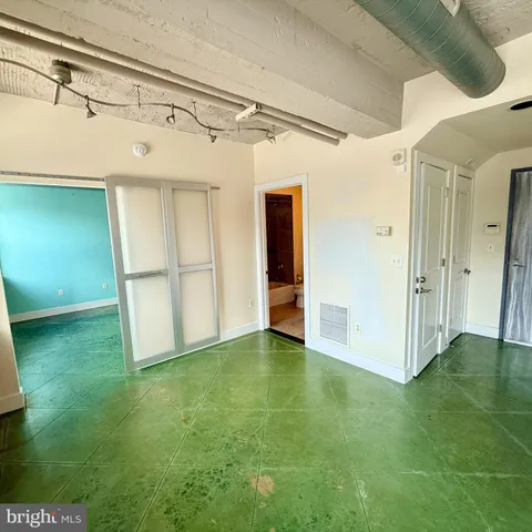 a view of room with window and carpet