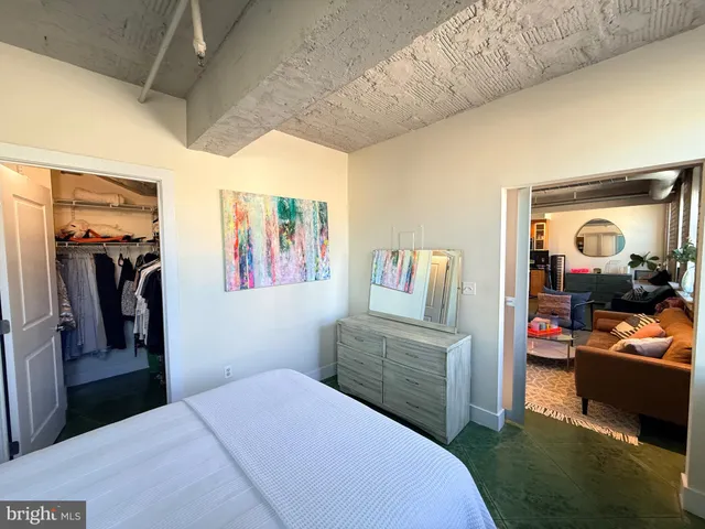 a view of spacious bedroom with a large window