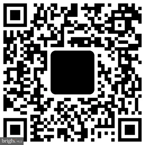 a view of kitchen with refrigerator and microwave