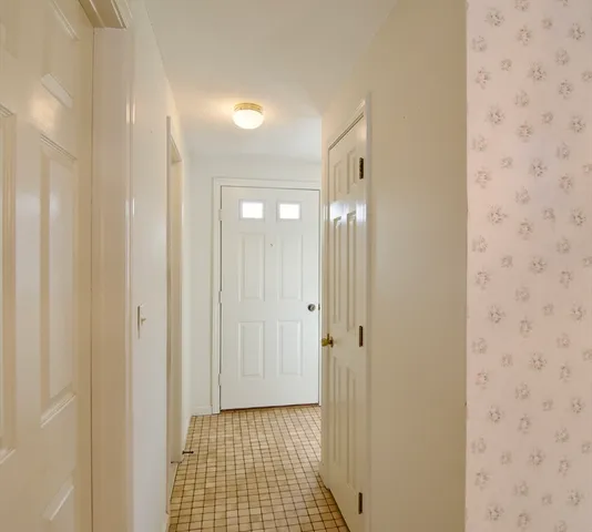 a view of a bathroom from a hallway