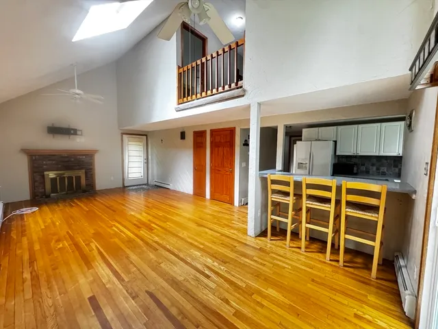 a view of a house with wooden floor and furniture
