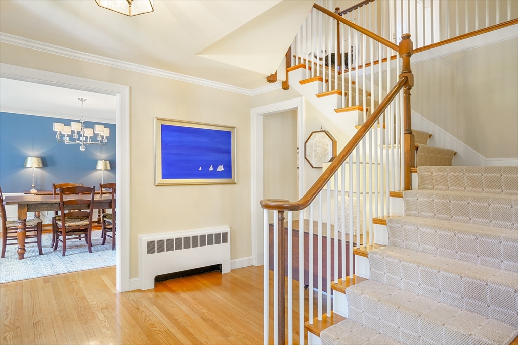 110 Hampshire Road Wellesley, MA 02481 - Photo 5 of 39 a view of entryway dining room and hall with wooden floor