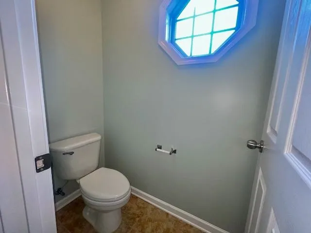 a bathroom with a toilet