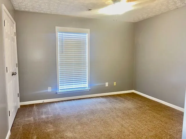 a view of a room that has a window in it