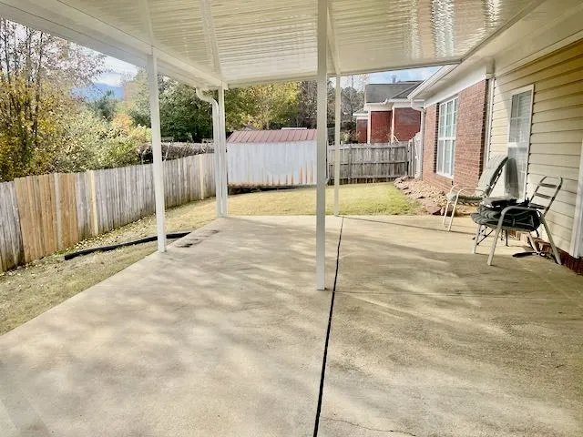 a view of a backyard patio