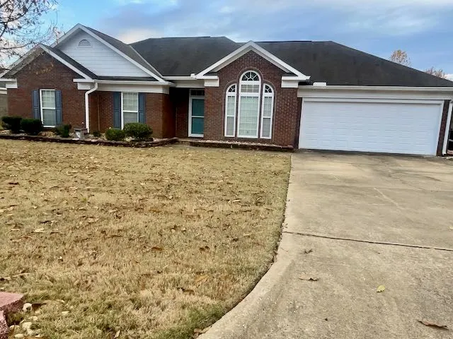 a front view of a house with yard