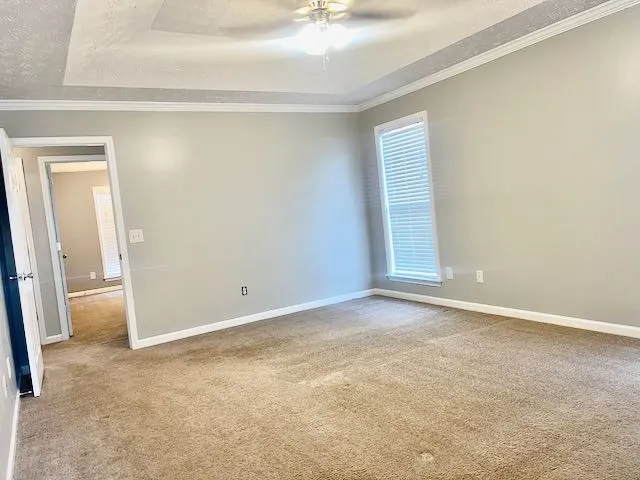 a view of an empty room and a window