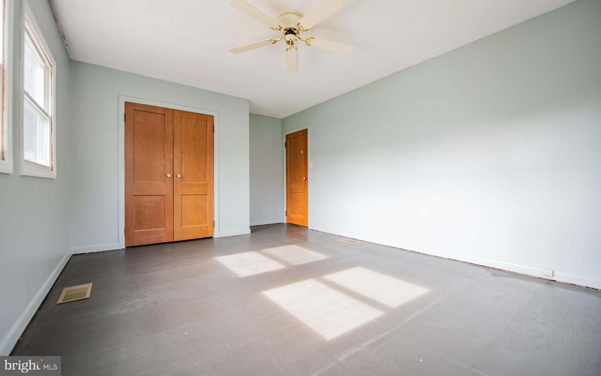 6 Oak Lane Lock Haven, PA 17745 - Photo 16 of 25 an empty room with chandelier fan and windows