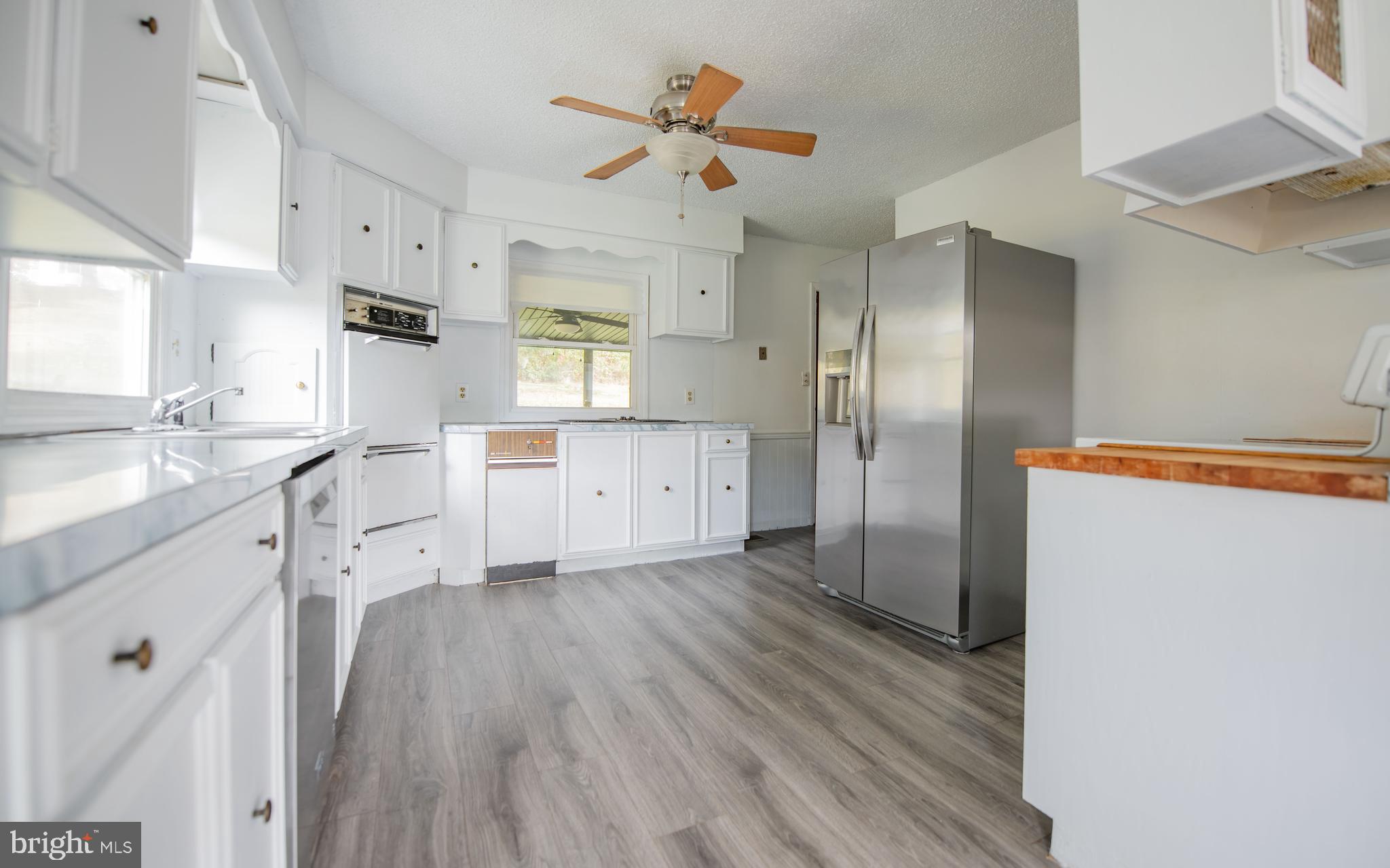 6 Oak Lane Lock Haven, PA 17745 - Photo 9 of 25 a kitchen with stainless steel appliances a refrigerator sink and cabinets