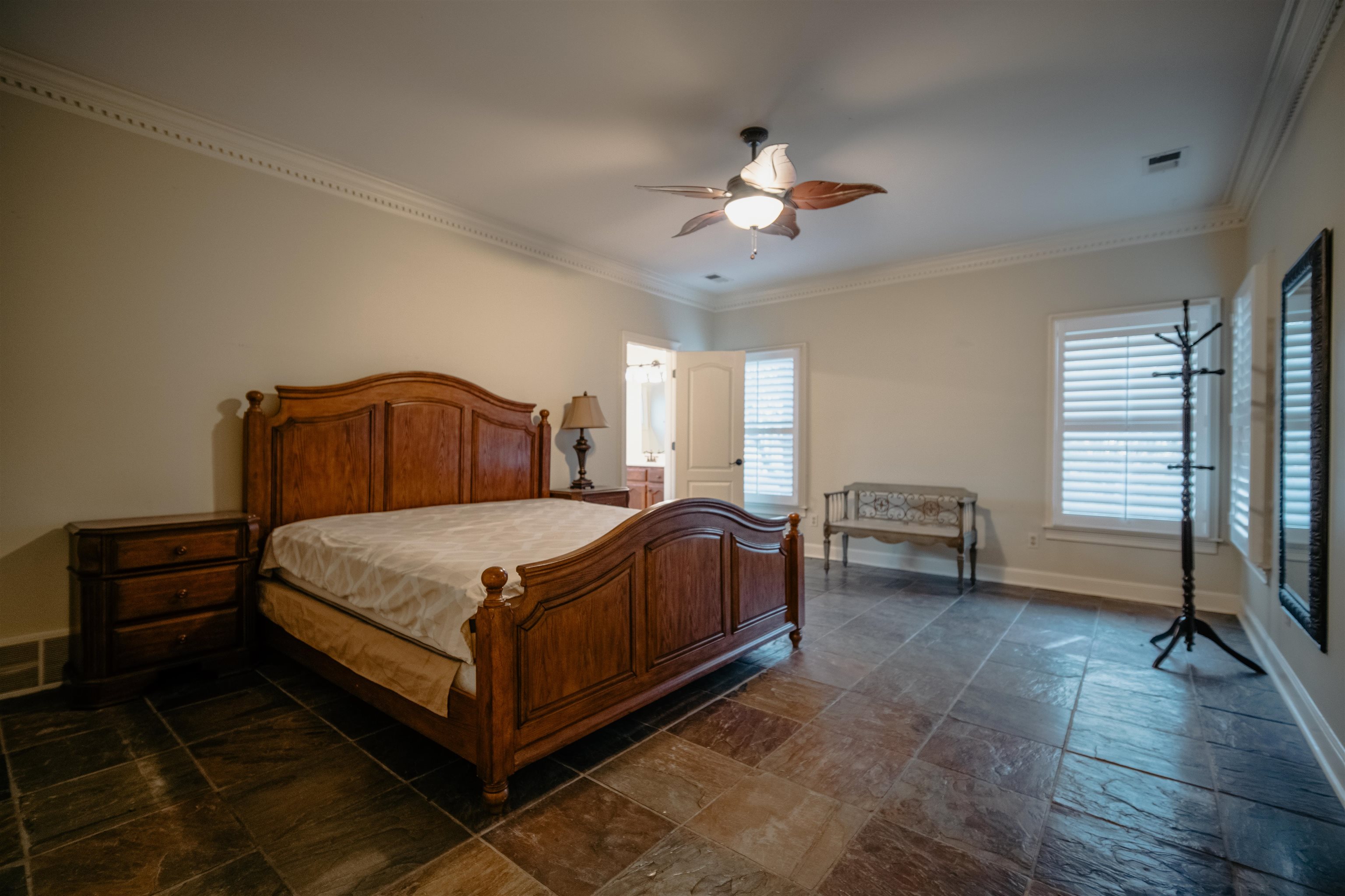 1275 Quinn Road Collierville, TN 38017 - Photo 12 of 34 a bedroom with a bed and a chandelier