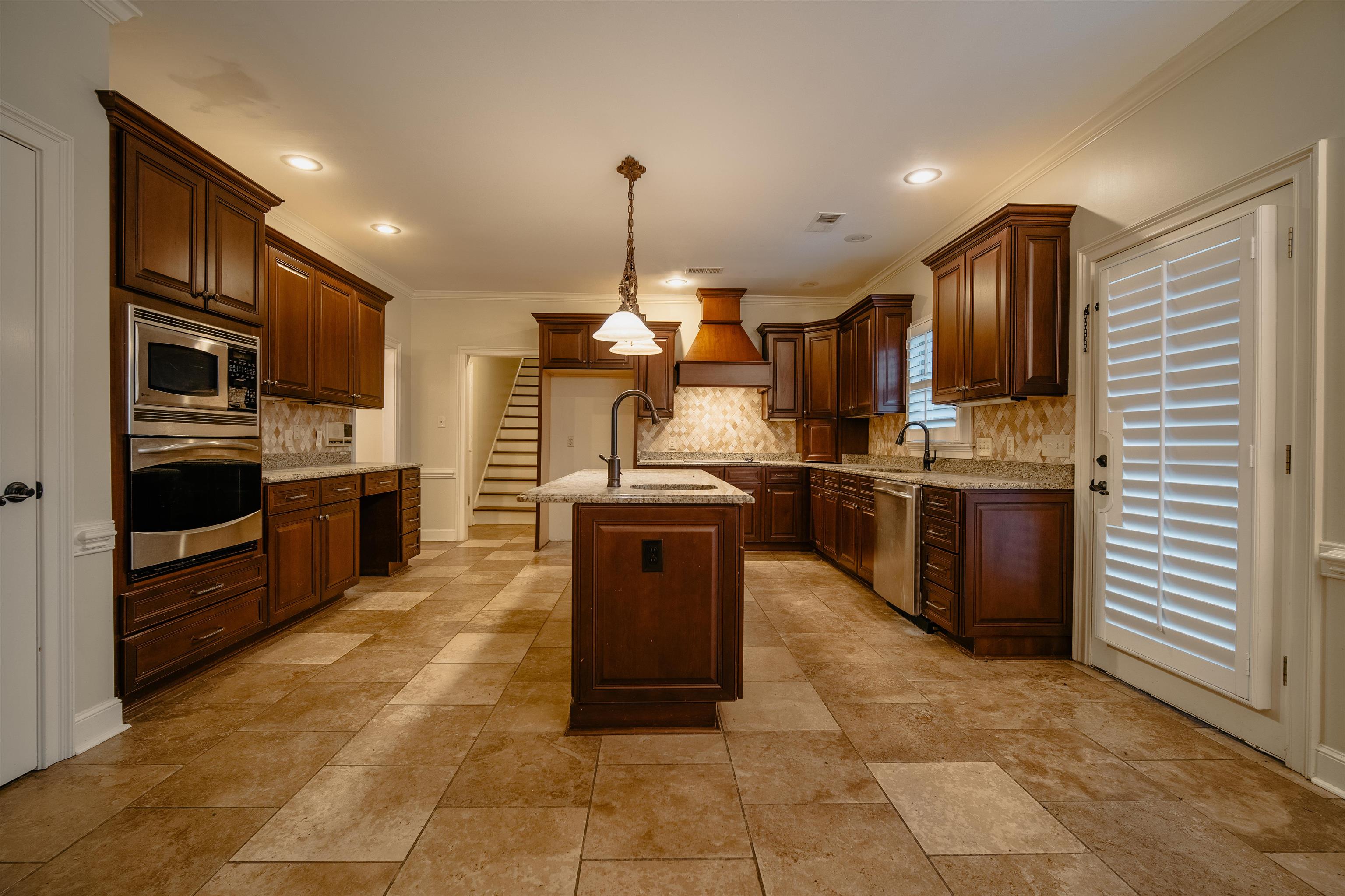 1275 Quinn Road Collierville, TN 38017 - Photo 7 of 34 a kitchen with stainless steel appliances granite countertop a stove a sink a oven and a refrigerator