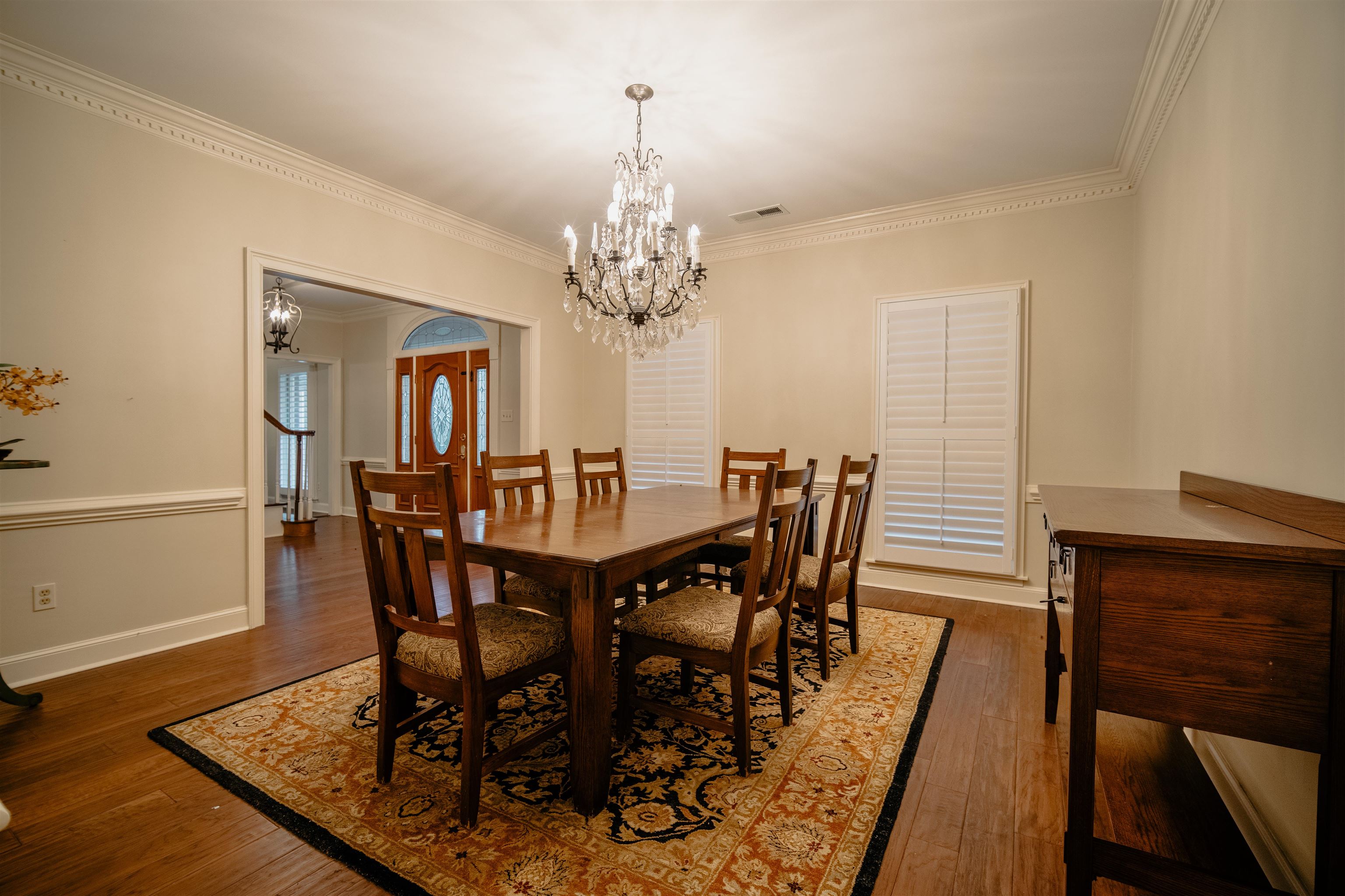 1275 Quinn Road Collierville, TN 38017 - Photo 8 of 34 a view of a dining room with furniture and wooden floor