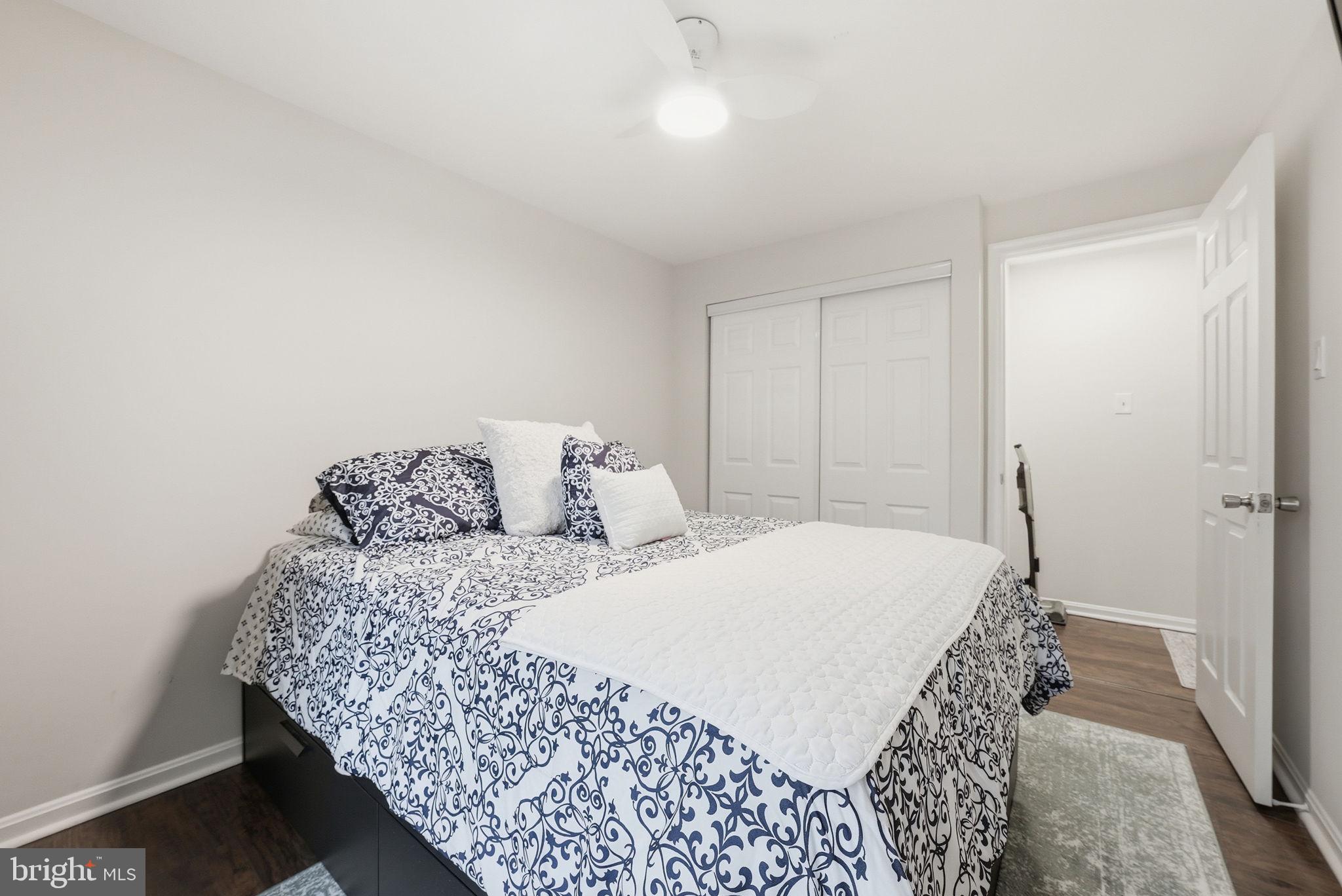 9236 Labelle Lane Gaithersburg, MD 20879 - Photo 17 of 33 Serene bedroom with modern elegance.