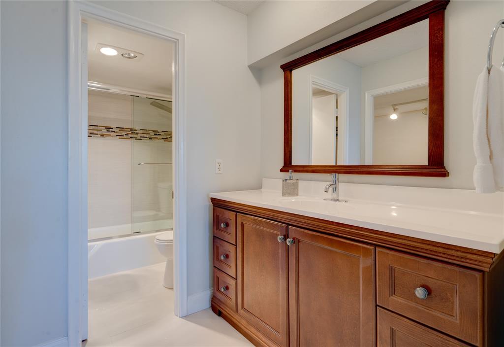 2000 South Ocean Boulevard, Unit 2L Lauderdale-by-the-Sea, FL 33062 - Photo 20 of 41 a bathroom with a sink and a mirror
