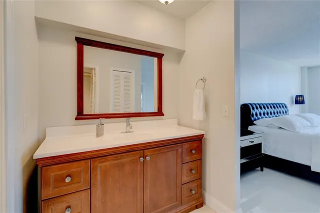 a bathroom with a shower a toilet and a sink