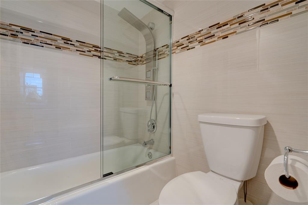 2000 South Ocean Boulevard, Unit 2L Lauderdale-by-the-Sea, FL 33062 - Photo 22 of 41 a bathroom with a shower a toilet and a sink