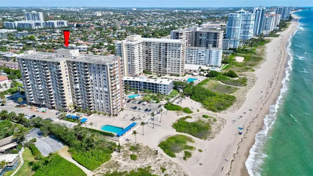 a view of a pool with chairs