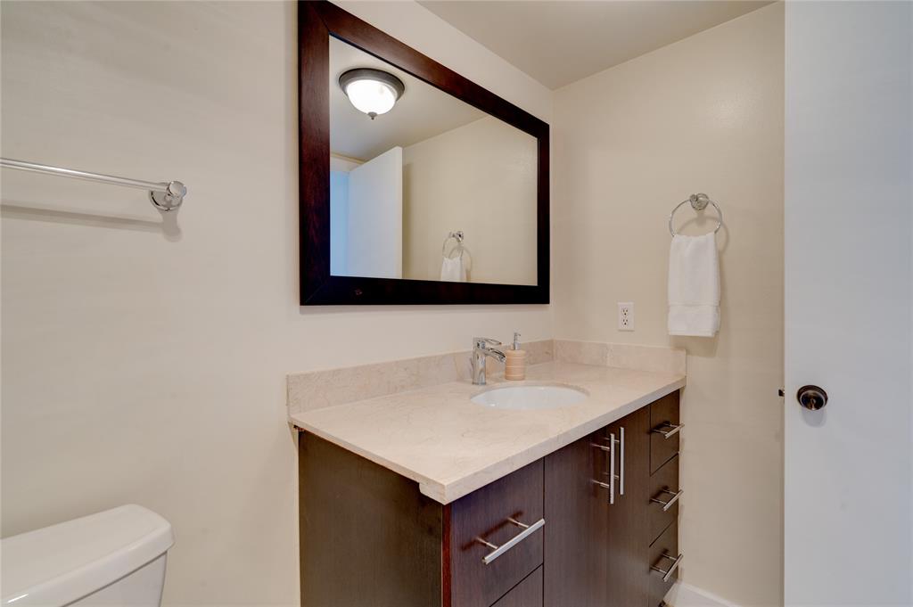 2000 South Ocean Boulevard, Unit 2L Lauderdale-by-the-Sea, FL 33062 - Photo 9 of 41 a bathroom with a sink and a mirror
