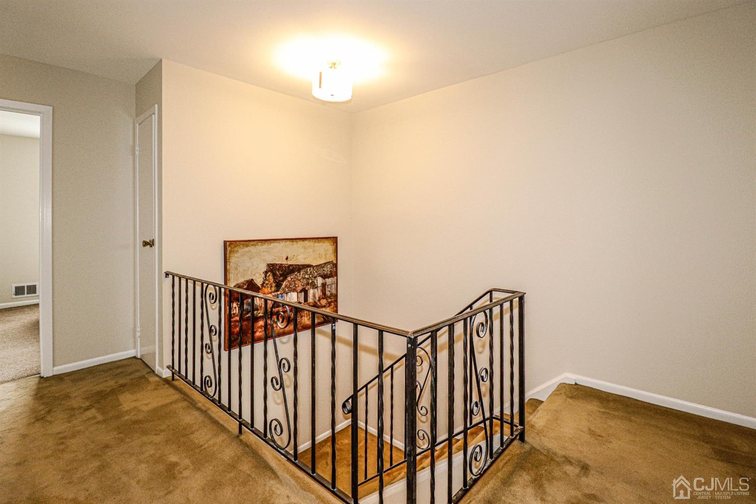 2 Redbud Road Piscataway, NJ 08854 - Photo 22 of 38 a view of a hallway with wooden floor
