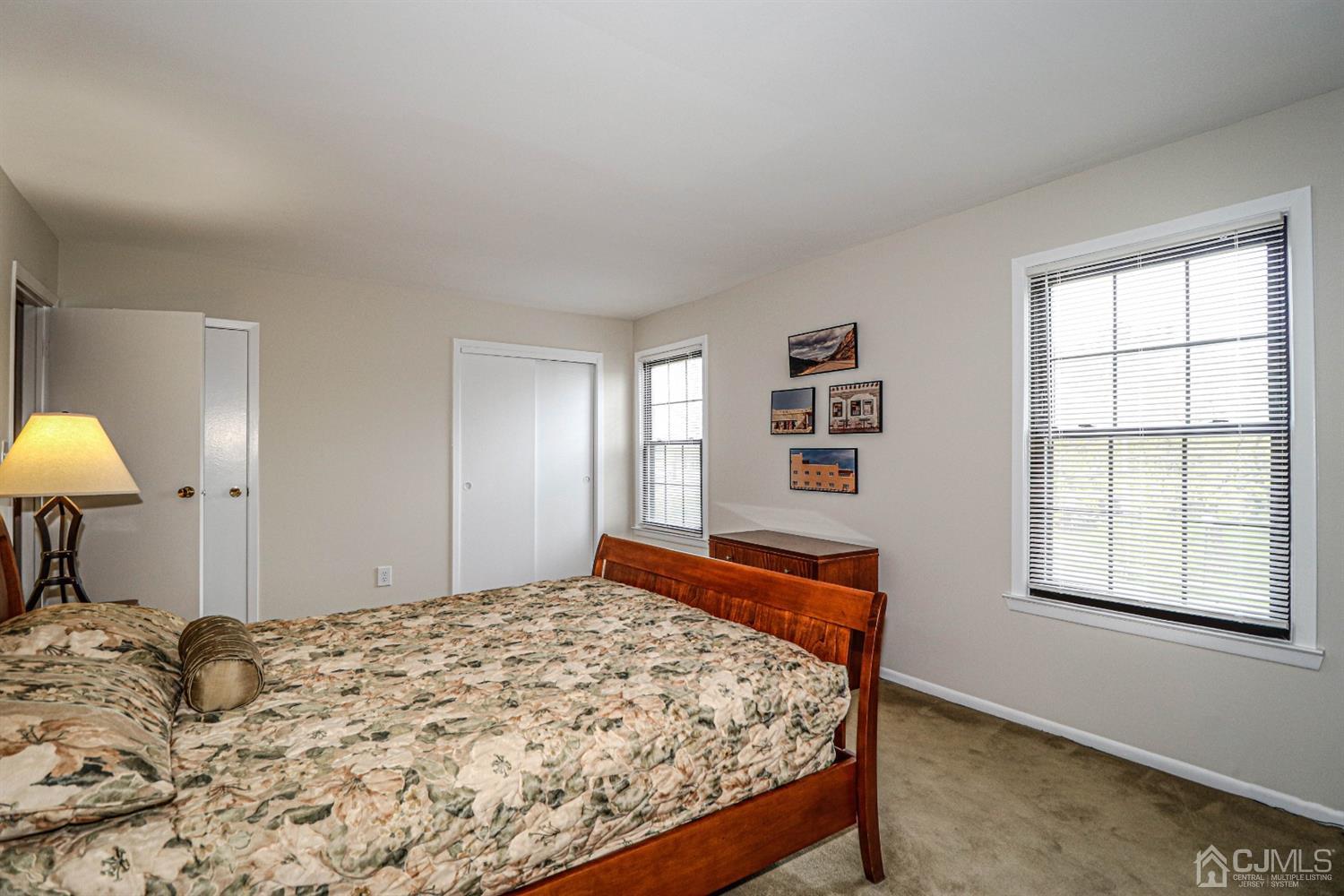 2 Redbud Road Piscataway, NJ 08854 - Photo 23 of 38 a bed sitting in a bedroom next to a window