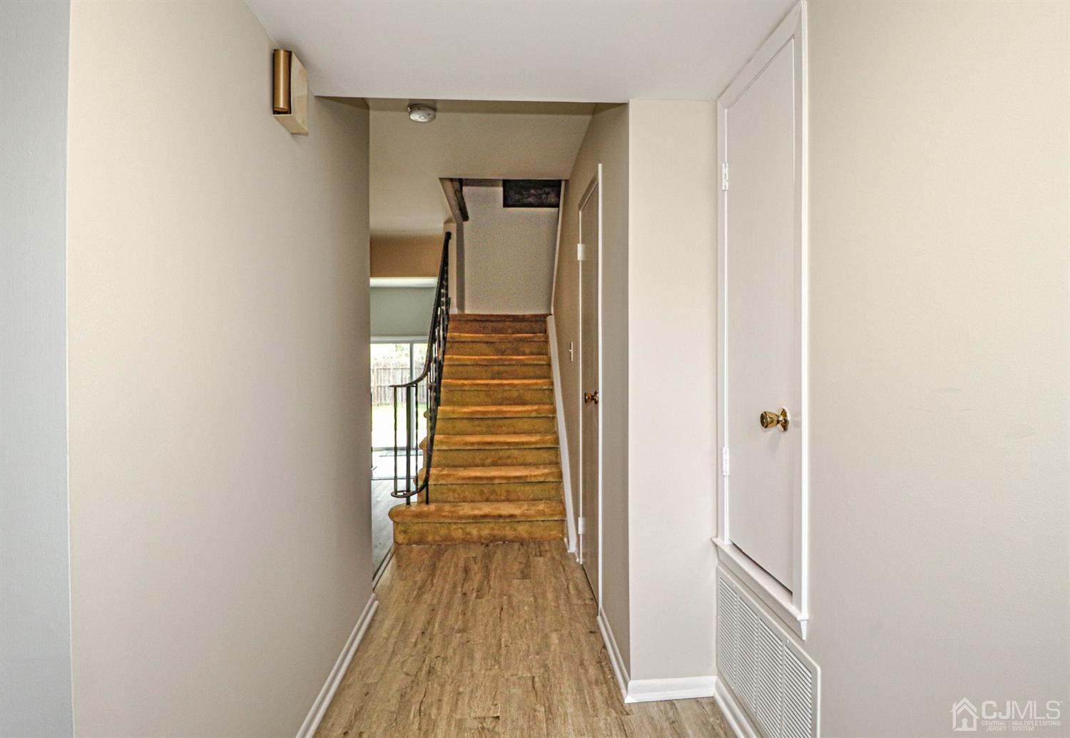 2 Redbud Road Piscataway, NJ 08854 - Photo 4 of 38 a view of a hallway with wooden floor and entryway