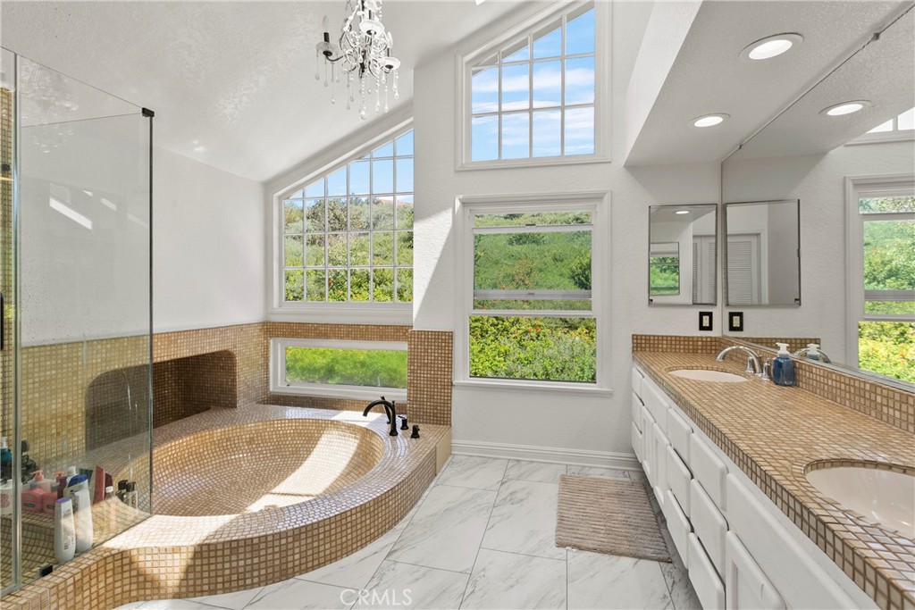 404 Calle Macho San Clemente, CA 92673 - Photo 17 of 19 a spacious bathroom with a granite countertop tub sink and large window