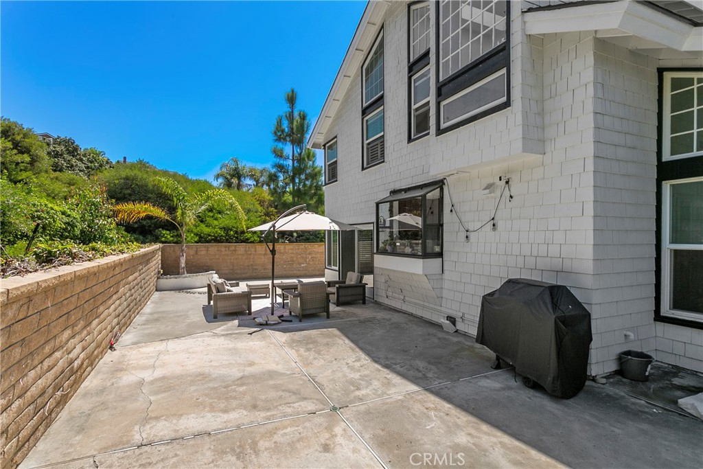 404 Calle Macho San Clemente, CA 92673 - Photo 19 of 19 a view of a patio with table and chairs and potted plants