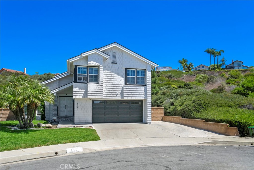 404 Calle Macho San Clemente, CA 92673 - Photo 3 of 19 a front view of a house with a yard and garage