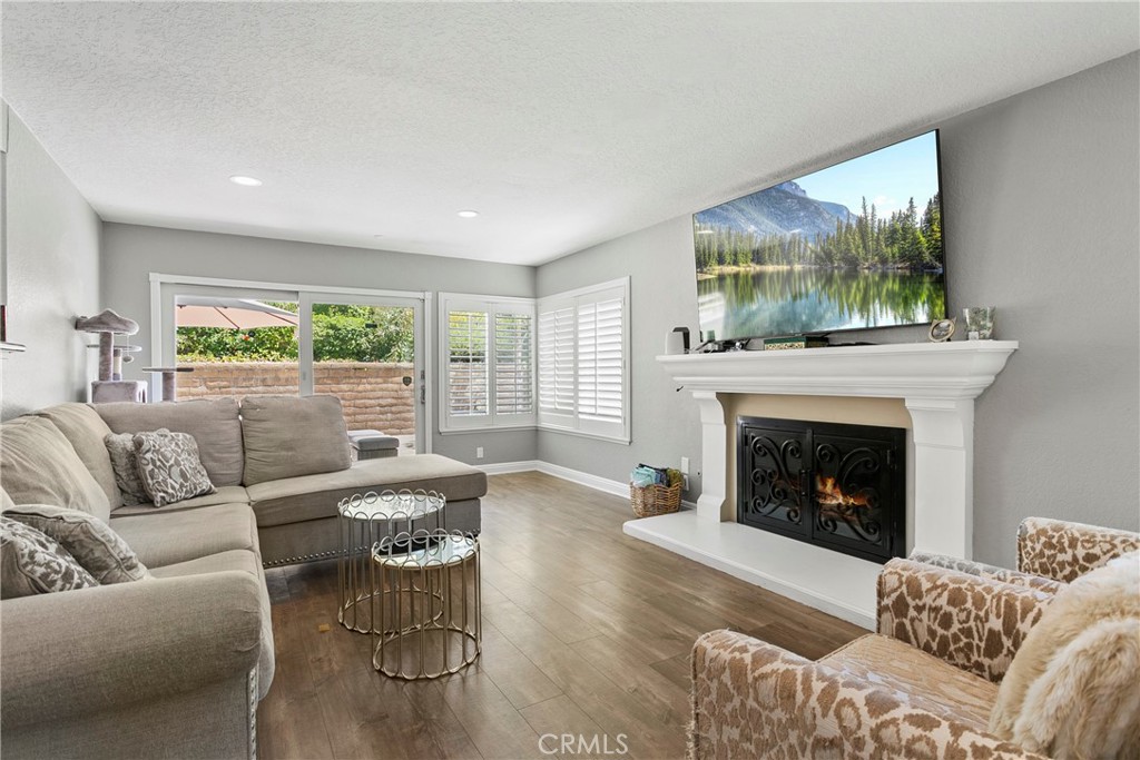 404 Calle Macho San Clemente, CA 92673 - Photo 7 of 19 a living room with furniture and a fireplace