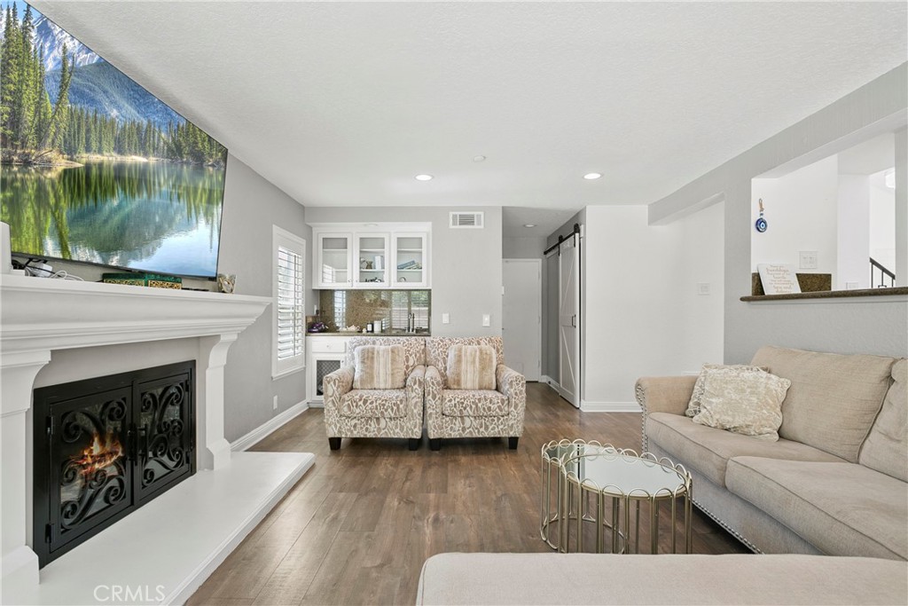 404 Calle Macho San Clemente, CA 92673 - Photo 8 of 19 a living room with furniture and a fireplace