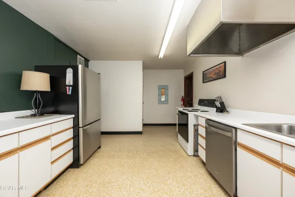 a bedroom with a bed and flat screen tv