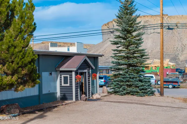 a front view of a house with parking space