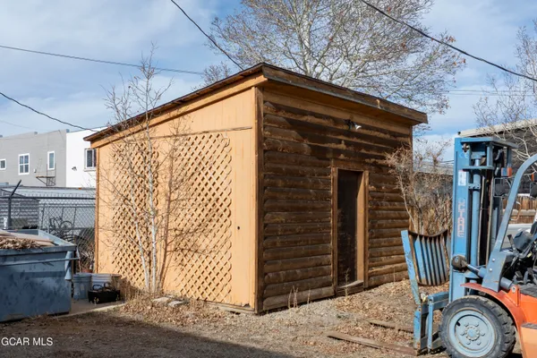 a bathroom with a toilet and a shower curtain