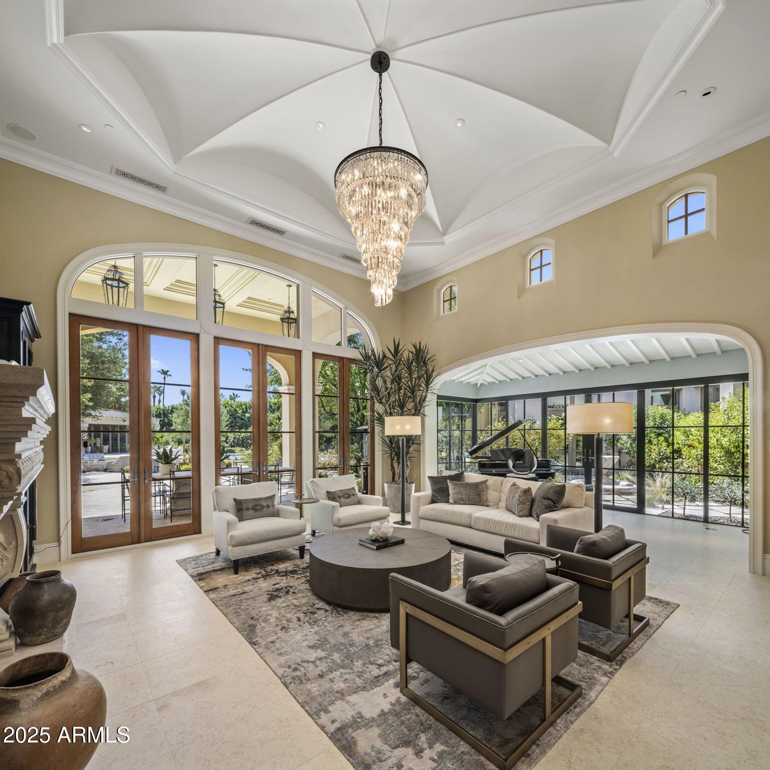 8345 Morning Glory Road Paradise Valley, AZ 85253 - Photo 15 of 37 a living room with patio furniture and a large window