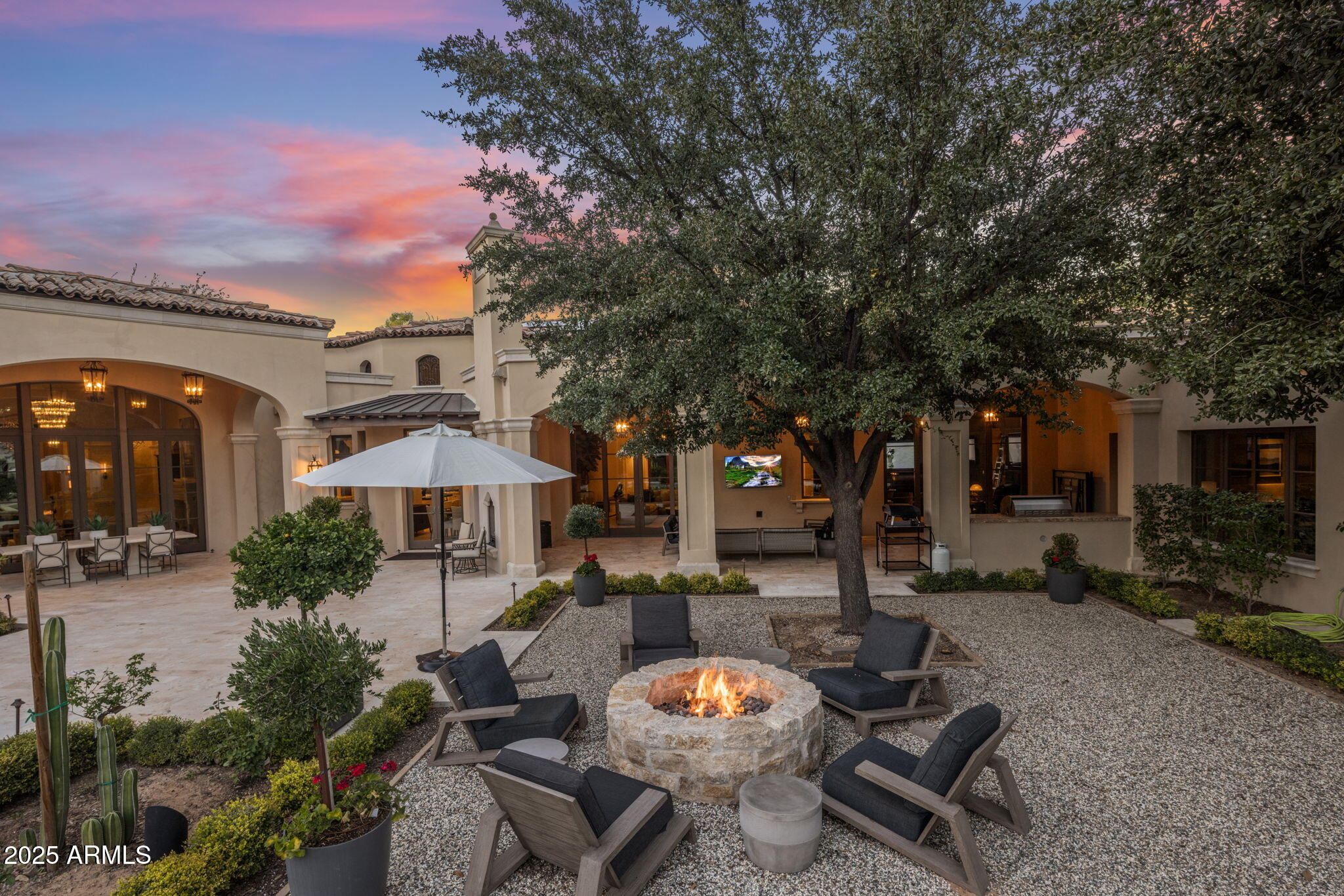 8345 Morning Glory Road Paradise Valley, AZ 85253 - Photo 33 of 37 a view of a patio with furniture and a fire pit