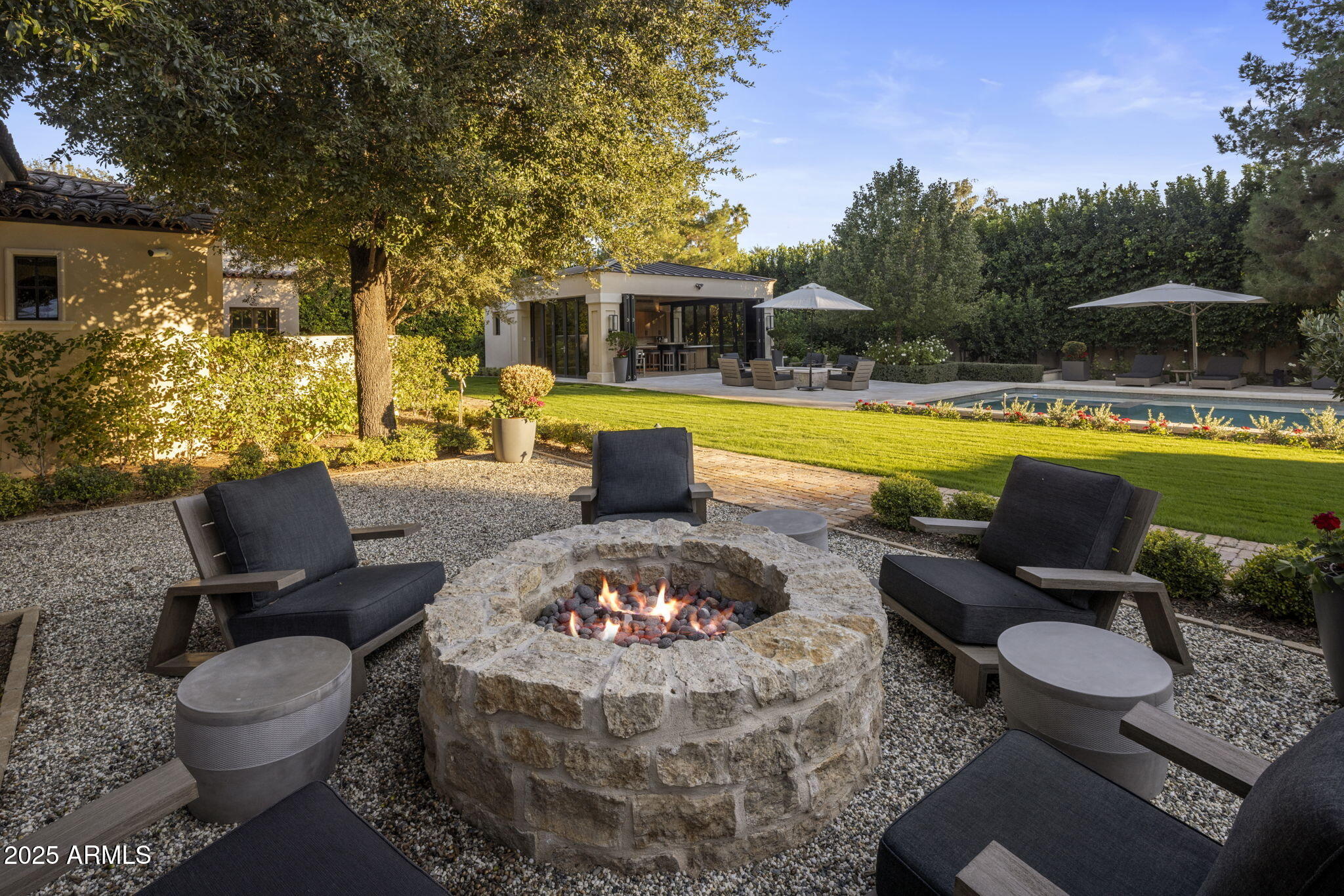 8345 Morning Glory Road Paradise Valley, AZ 85253 - Photo 34 of 37 a living room with furniture and a swimming pool