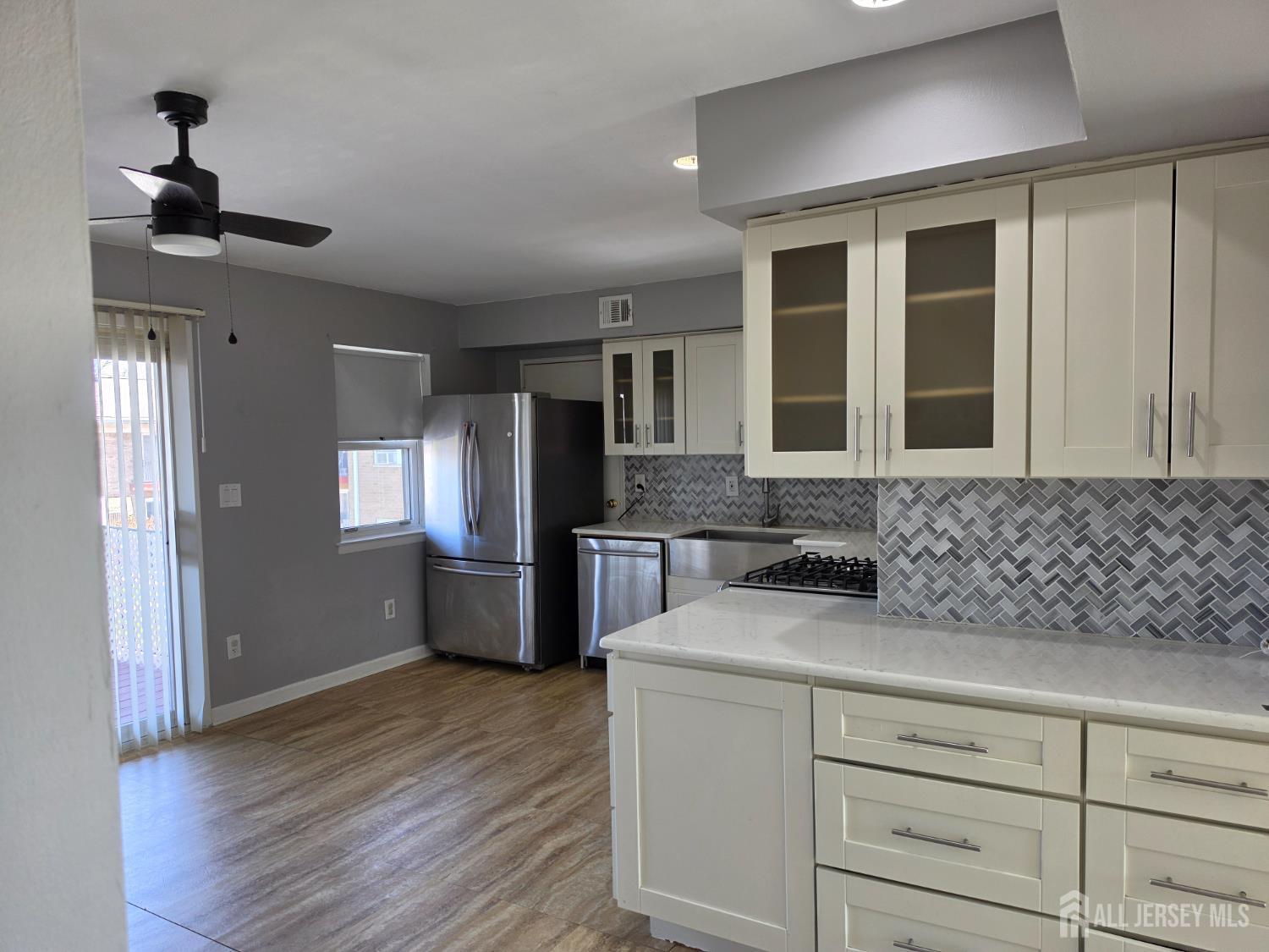 192 Evergreen Road, Unit 7B Edison, NJ 08837 - Photo 11 of 21 a kitchen with a refrigerator and a sink