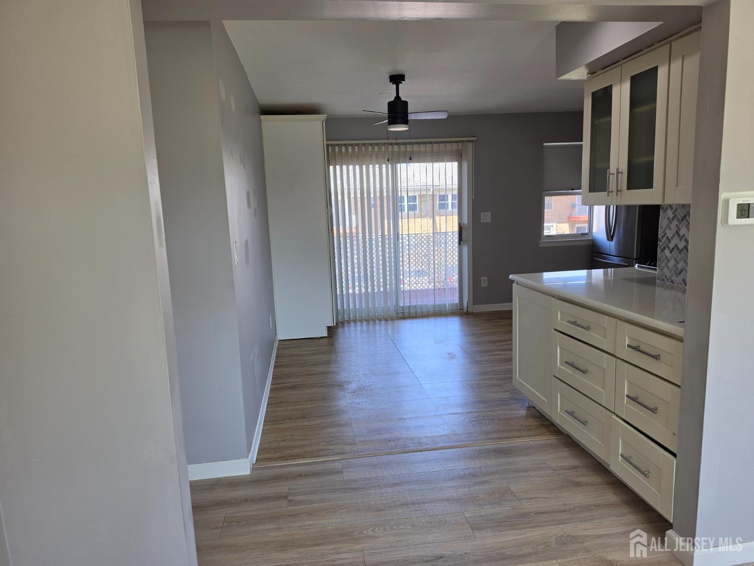 192 Evergreen Road, Unit 7B Edison, NJ 08837 - Photo 12 of 21 a hall with cabinets wooden floor and a window