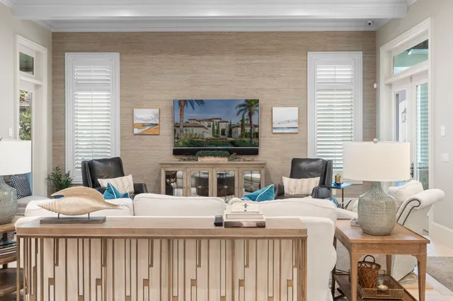 a bedroom with a large bed and a flat tv screen