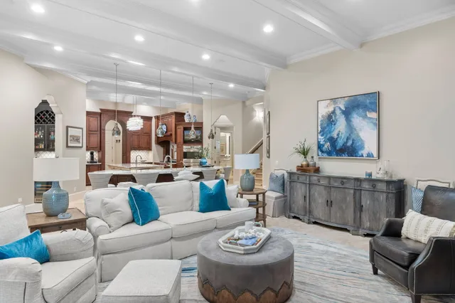 a spacious bedroom with a bed and glass walk in closet