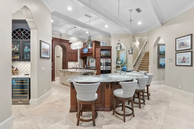 a bathroom with a granite countertop sink a mirror and window